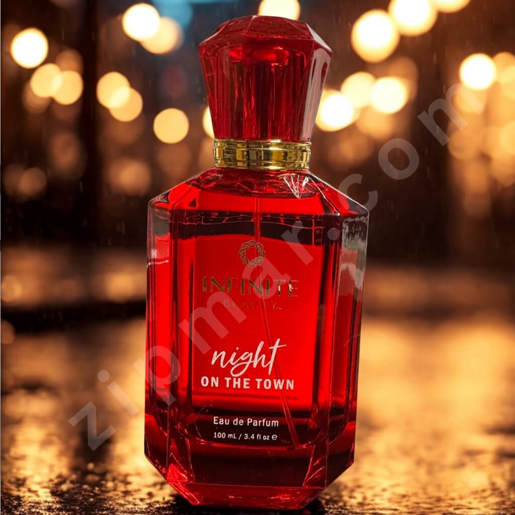 Red perfume bottle labeled 'Night on the Town' with a blurred lights background