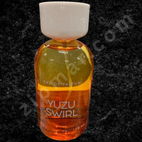 Thumbnail for Bottle of Yuzu Swirl eau de parfum on a dark background