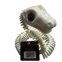 Thumbnail for Angled view of coiled skeleton snake showing barcode hangtag