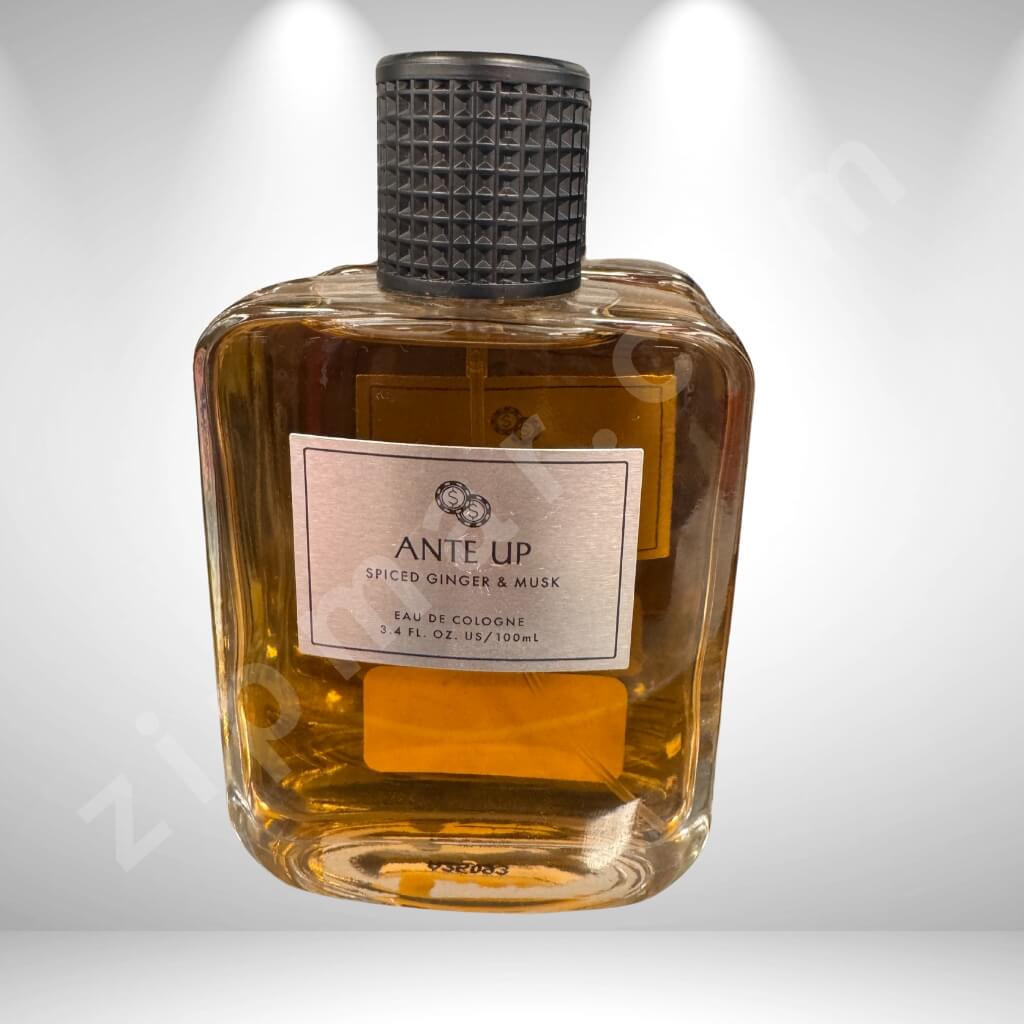 Bottle of Ante Up cologne with a textured black cap on a light gray background