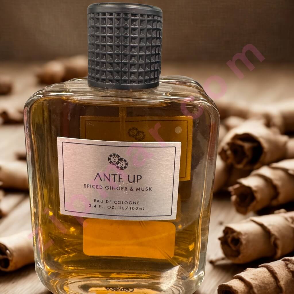 Bottle of 'Ante Up' cologne with cinnamon sticks in the background