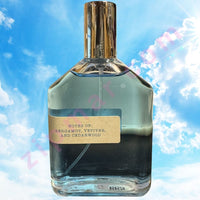 Thumbnail for Perfume bottle with a label on a blue sky background