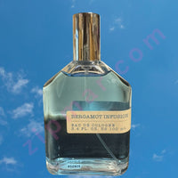 Thumbnail for Perfume bottle labeled 'Bergamot Infusion' against a blue sky background