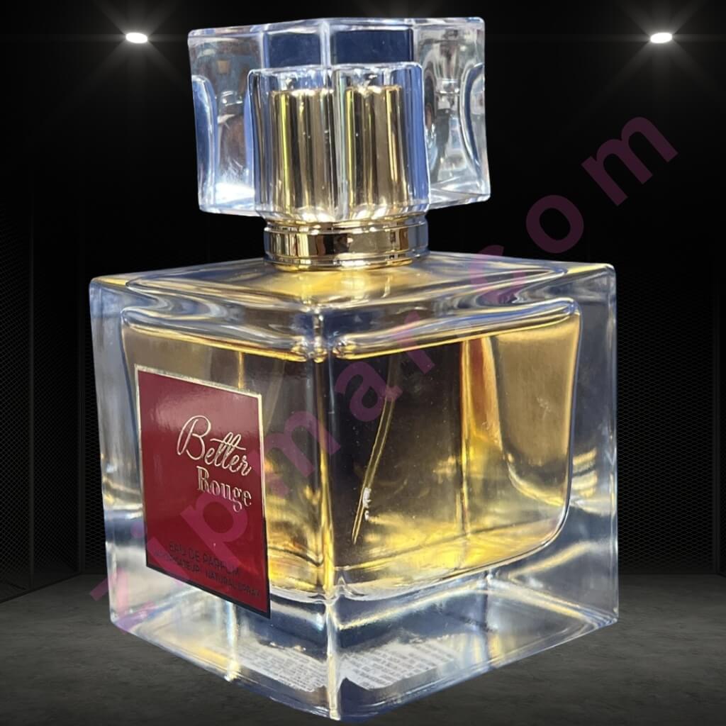 Perfume bottle with a clear design and gold accents on a dark background