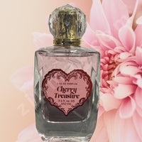 Thumbnail for Perfume bottle labeled 'Cherry Treasure' with a pink flower in the background