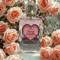 Thumbnail for Perfume bottle labeled 'Cherry Treasure' surrounded by pink roses