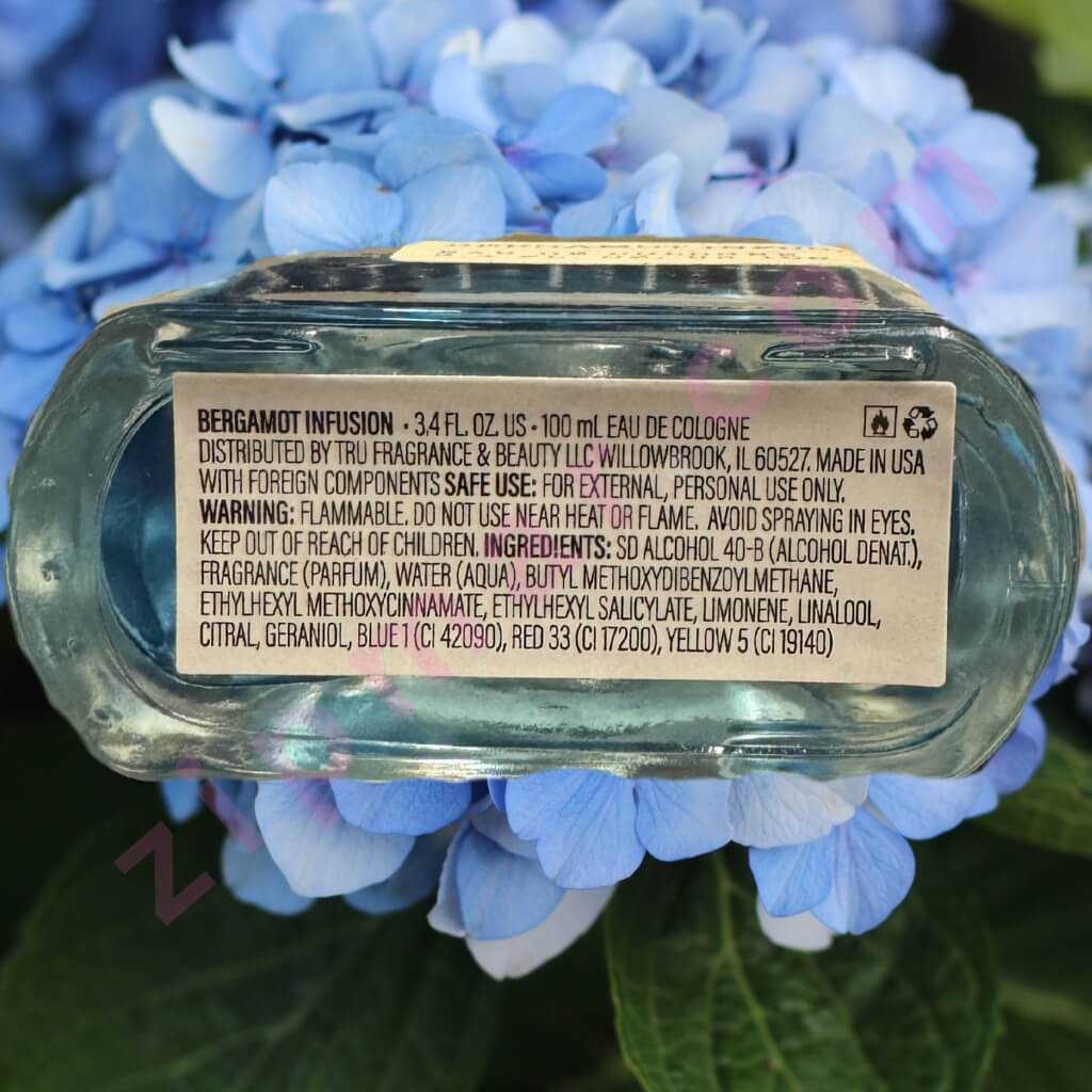 Perfume bottle label on a blue flower background