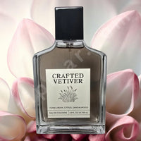 Thumbnail for Perfume bottle labeled 'Crafted Vetiver' with pink floral background