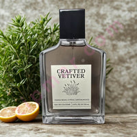 Thumbnail for Bottle of 'Crafted Vetiver' cologne with lemons and herbs on a wooden surface