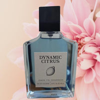Thumbnail for Perfume bottle labeled 'Dynamic Citrus' with pink flowers in the background