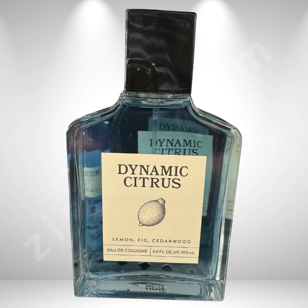 Bottle of Dynamic Citrus cologne with a lemon illustration on a white background