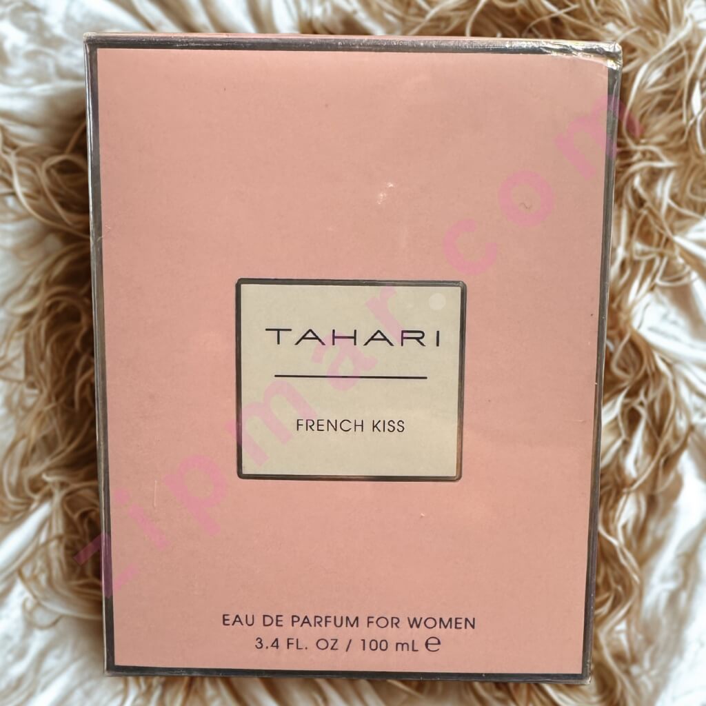 Tahari French Kiss perfume box on a textured surface