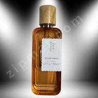 Thumbnail for Brown perfume bottle with wooden cap on a gray background