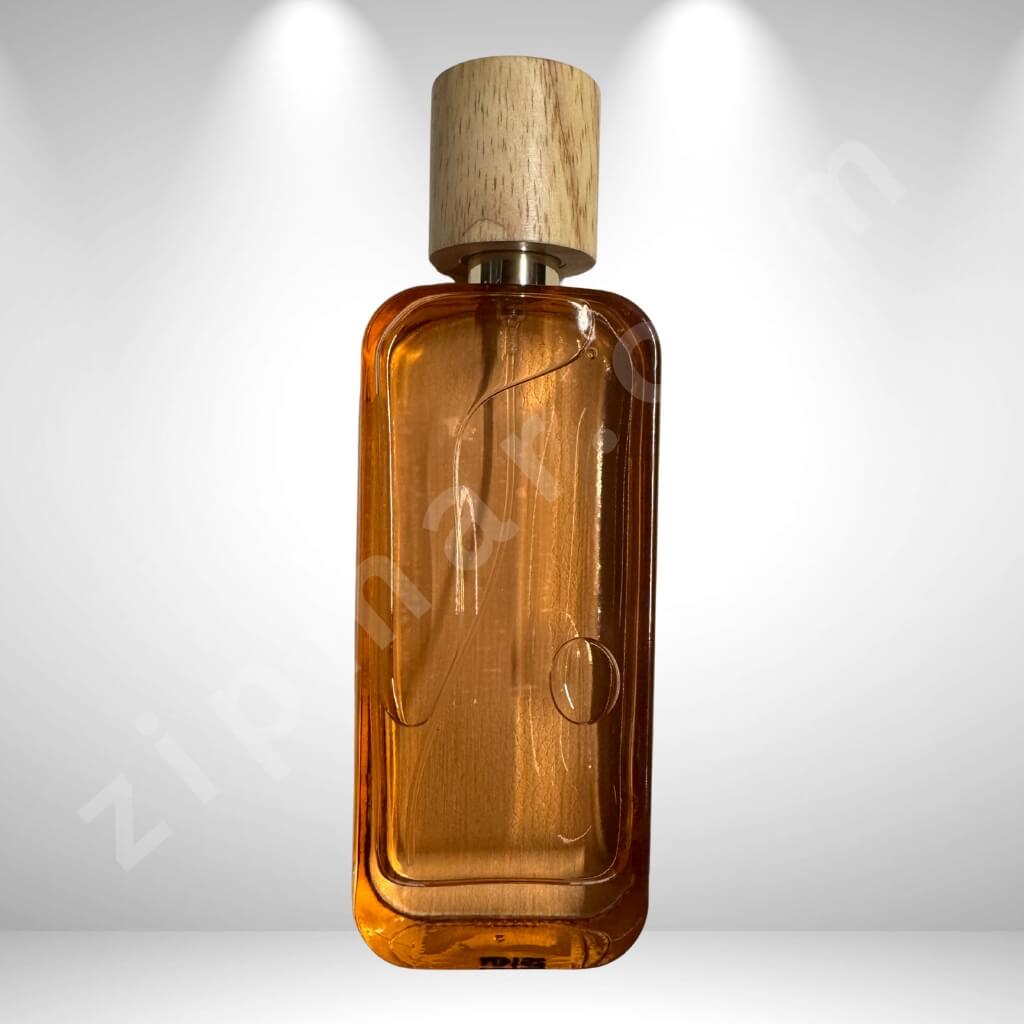 Brown glass bottle with wooden cap on a white background