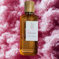 Thumbnail for Perfume bottle with wooden cap on a pink fluffy background