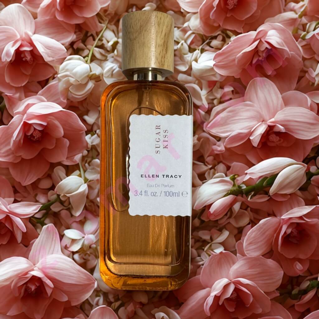Perfume bottle labeled 'Sugar Kiss' by Ellen Tracy on a bed of pink flowers