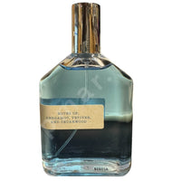 Thumbnail for Perfume bottle with a label on a white background