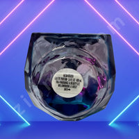 Thumbnail for Glass perfume bottle with a label on a blue and pink neon light background
