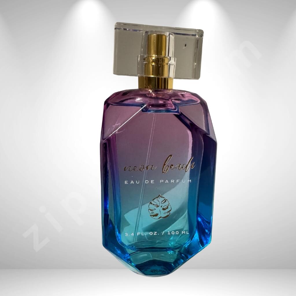 Blue and purple perfume bottle with gold cap on a white background