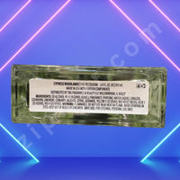 Thumbnail for Glass bottle with label on a blue and pink geometric background