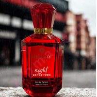 Thumbnail for Red perfume bottle labeled 'night on the town' with a blurred background