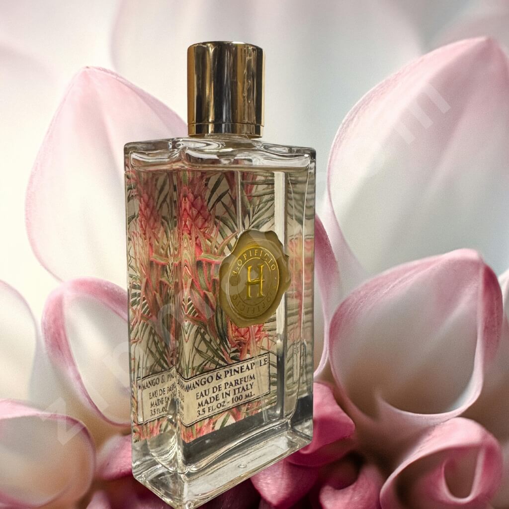 Perfume bottle with floral design on a pink flower background