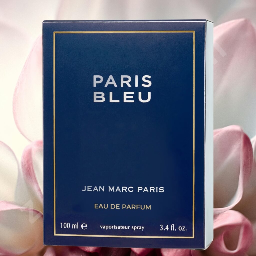 Blue box of 'Paris Bleu' perfume by Jean Marc Paris with pink flowers in the background