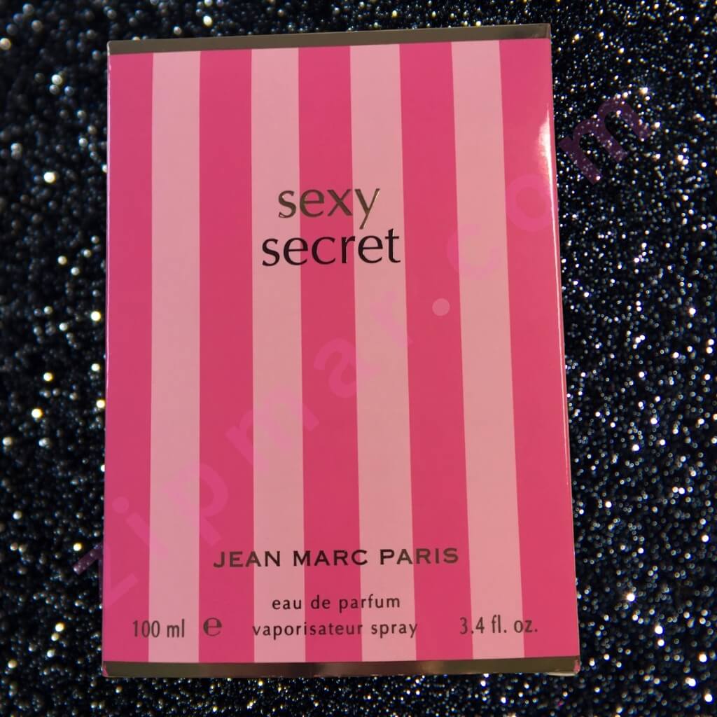 Pink striped packaging of 'sexy secret' by Jean Marc Paris on a glittery black background