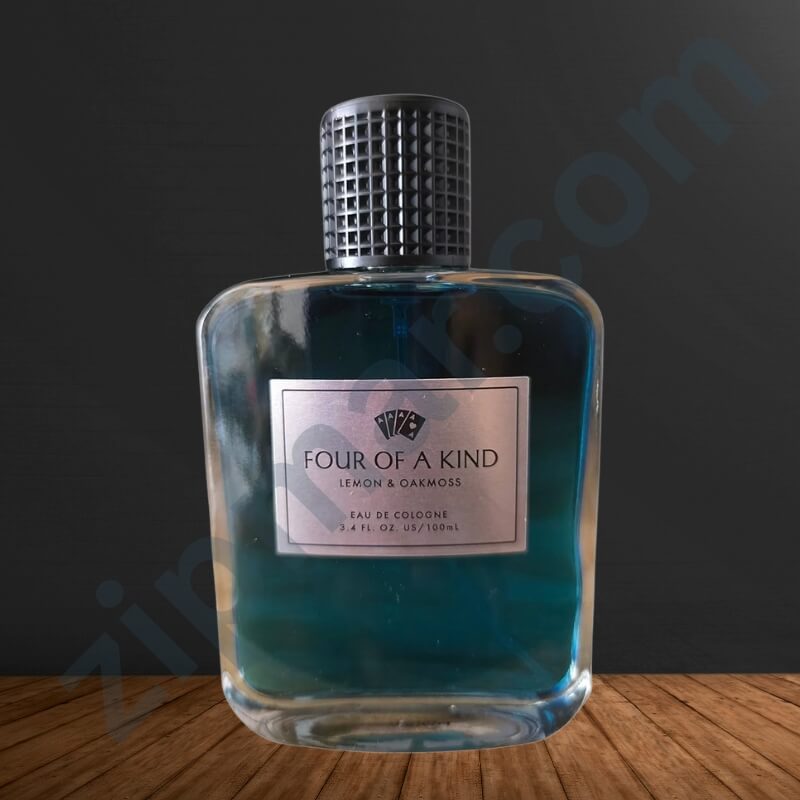Perfume bottle labeled 'Four of a Kind' on a wooden surface with a dark background