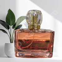Thumbnail for Perfume bottle labeled 'English Laundry' with a plant in the background