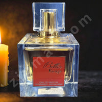 Thumbnail for Perfume bottle labeled 'Belle Rouge' with a candle in the background