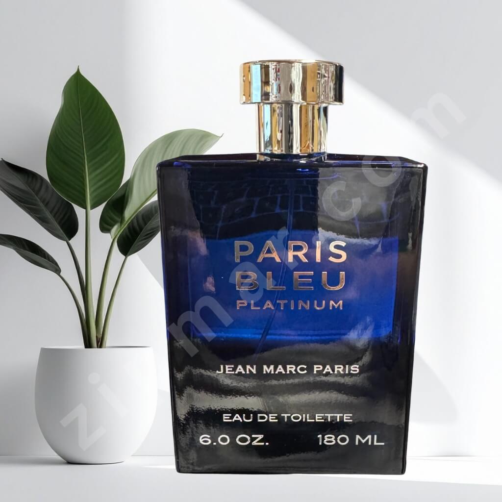 Blue perfume bottle labeled 'Paris Bleu Platinum' by Jean Marc Paris on a white background with a plant.
