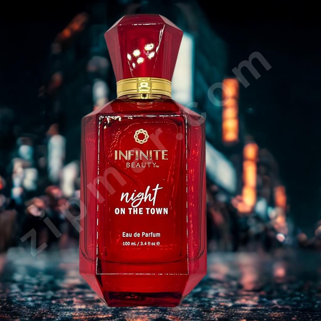 Red perfume bottle labeled 'Infinite Beauty Night on the Town' against a blurred cityscape background.