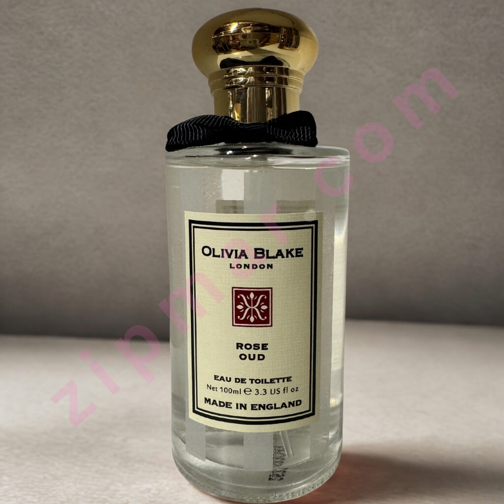 Perfume bottle labeled 'Olivia Blake London Rose Oud' on a neutral background