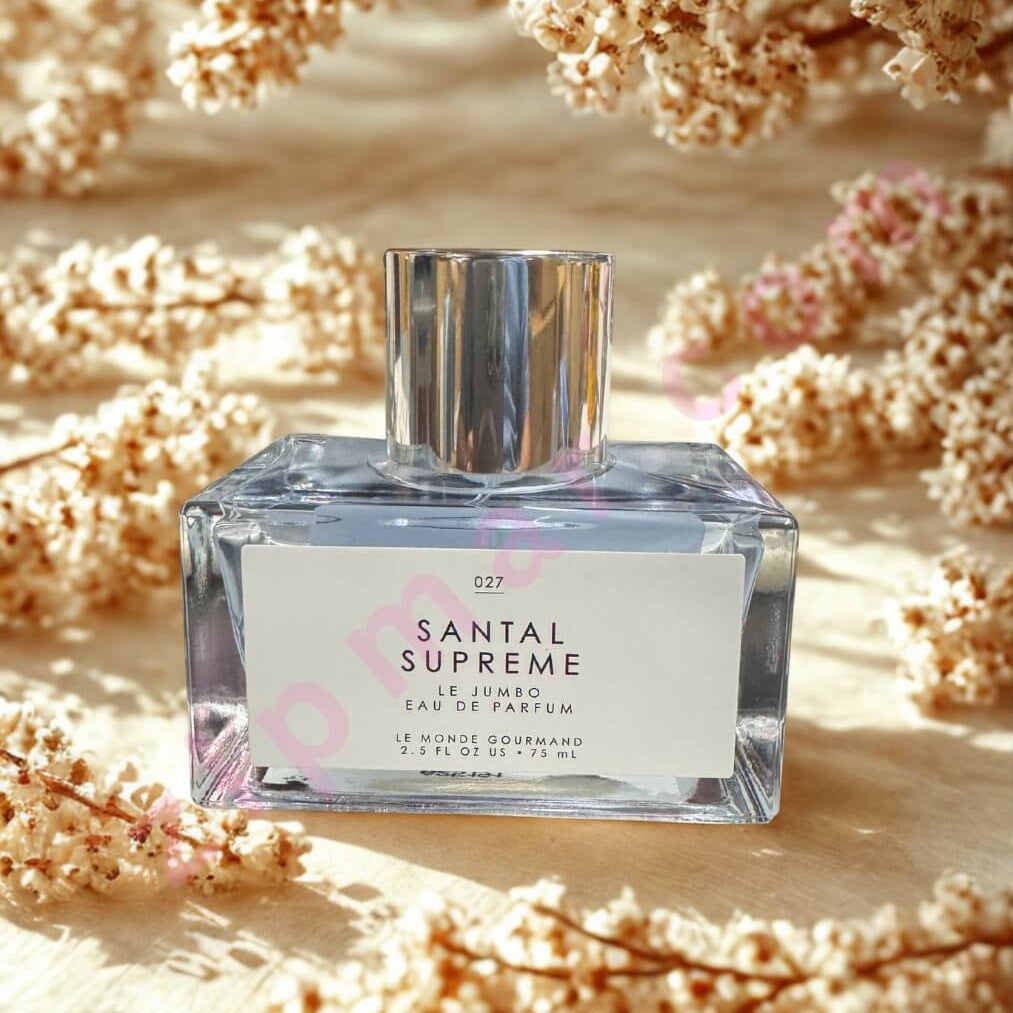 Santal Supreme perfume bottle with floral background