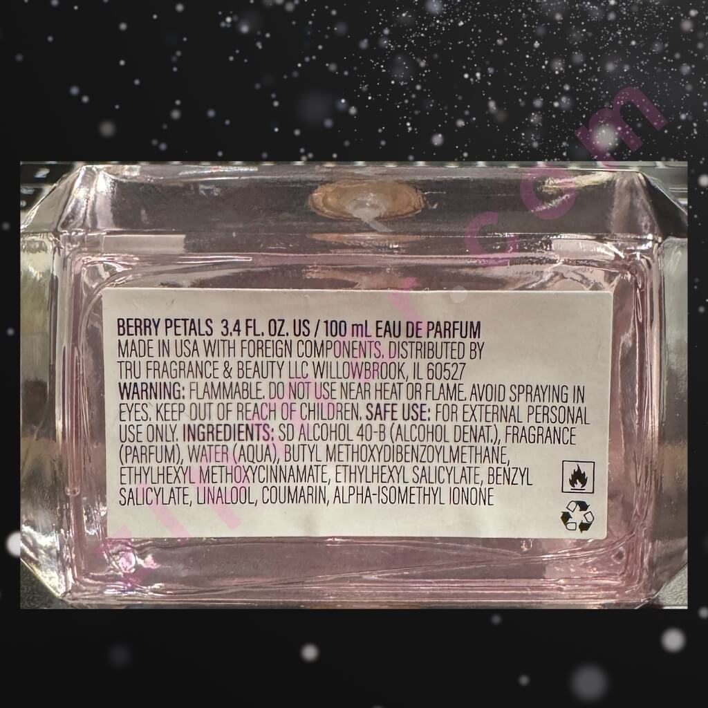 Back label of a perfume bottle with product details on a dark background