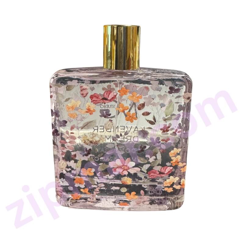 Perfume bottle with floral design on a white background