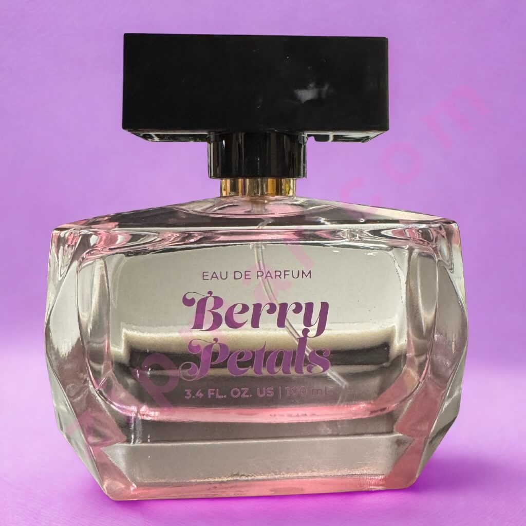 Perfume bottle labeled 'Berry Petals' on a purple background