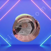 Thumbnail for Round metallic object with a label on a blue and pink geometric background