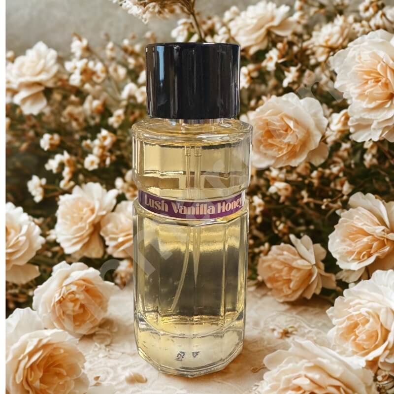 Perfume bottle labeled 'Lush Vanilla Honey' surrounded by flowers