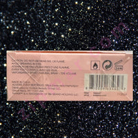 Thumbnail for Product packaging with text and symbols on a dark, starry background