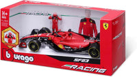 Thumbnail for An angled perspective shot of the Bburago 1:24 Ferrari SF23 F1 diecast car and driver figurine set in its collector's box.