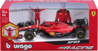 Thumbnail for The Bburago 1:24 Ferrari SF23 F1 diecast model and figurine displayed inside its premium collector's packaging box.