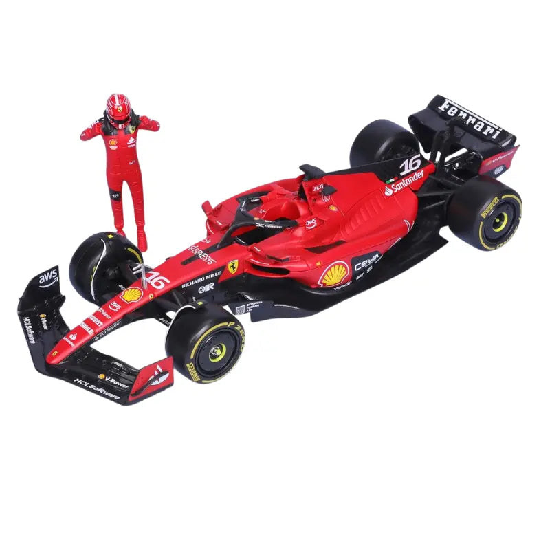 Bburago 1:24 Ferrari SF23 F1 race car with pilot figurine displayed beside it