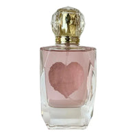 Thumbnail for Rear view of the clear faceted glass bottle for Cherry Treasure showing the pink-tinted fragrance liquid.