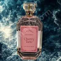 Thumbnail for Perfume bottle labeled 'Cherry Tarté' with a decorative pink label on a textured blue background.