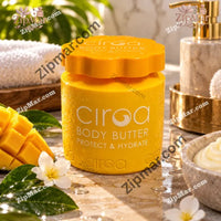 Thumbnail for Ciroa Body Butter yellow jar on a marble tray with mango, white flowers and a towel