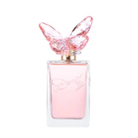 Thumbnail for Dolly Parton Scent from Above Eau de Toilette clear glass perfume bottle with light pink liquid and distinctive crystal butterfly cap.