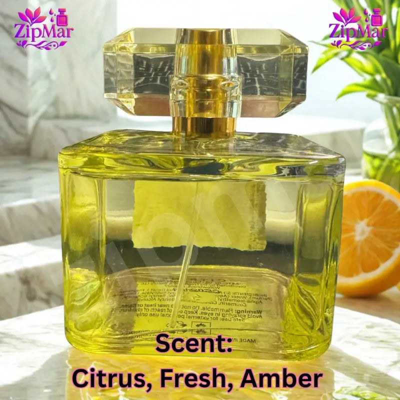Back view of Element Edition X Citrine Eau de Parfum yellow tinted square glass bottle with gold sprayer and faceted cap