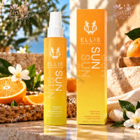Thumbnail for Ellis Brooklyn SUN Fragrance Body Mist 3.38 fl oz bottle standing next to yellow retail box with fresh orange slices